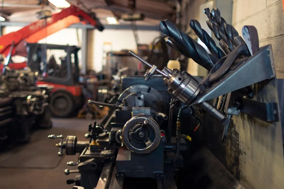Industrial workshop with machine tools, a tool rack and a forklift